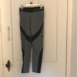 Nike Pro grey leggings with black accents.